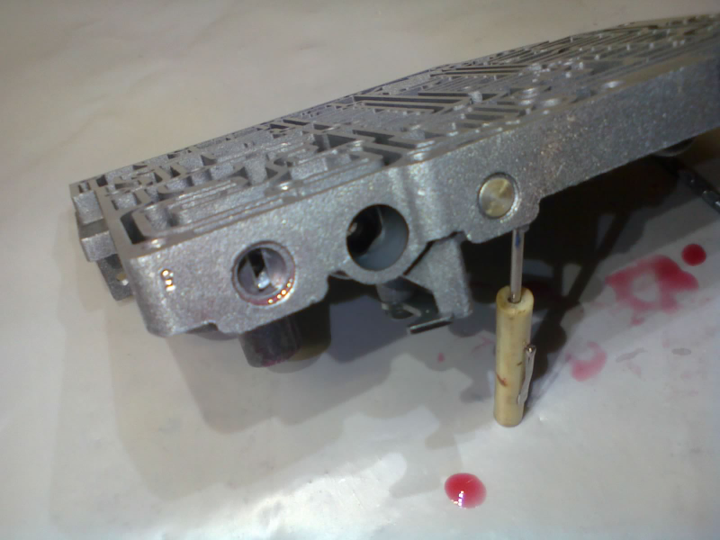I never did find out what this valve was called, but it was one of the easier ones to reassemble. Just one valve, one spring, and a retainer.